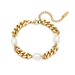 Indulge in timeless elegance with our Ladies Freshwater Pearl Stainless Steel Cuban Chain Bracelet. Featuring luminous freshwater pearls delicately interspersed along a sturdy stainless steel Cuban chain, this bracelet seamlessly blends sophistication with durability. Elevate any ensemble with its understated yet chic design, making it a versatile addition to your jewellery collection for both casual outings and formal occasions.