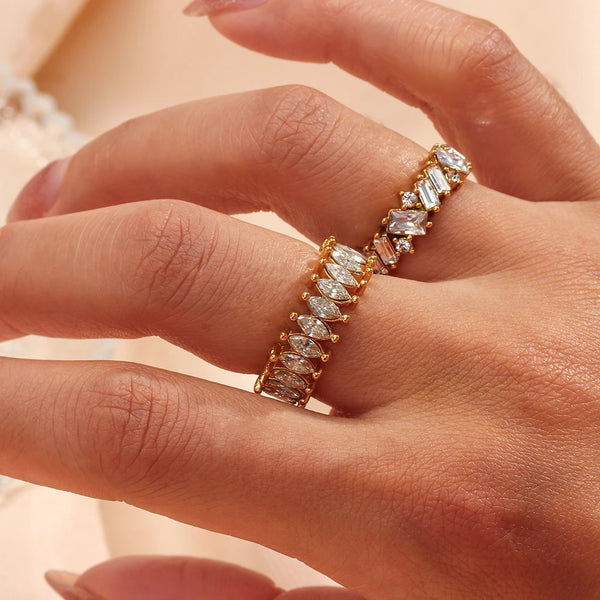 "Close-up of a gold ring with a band formed from cubic zirconia crystals, radiating shimmering elegance and luxury."