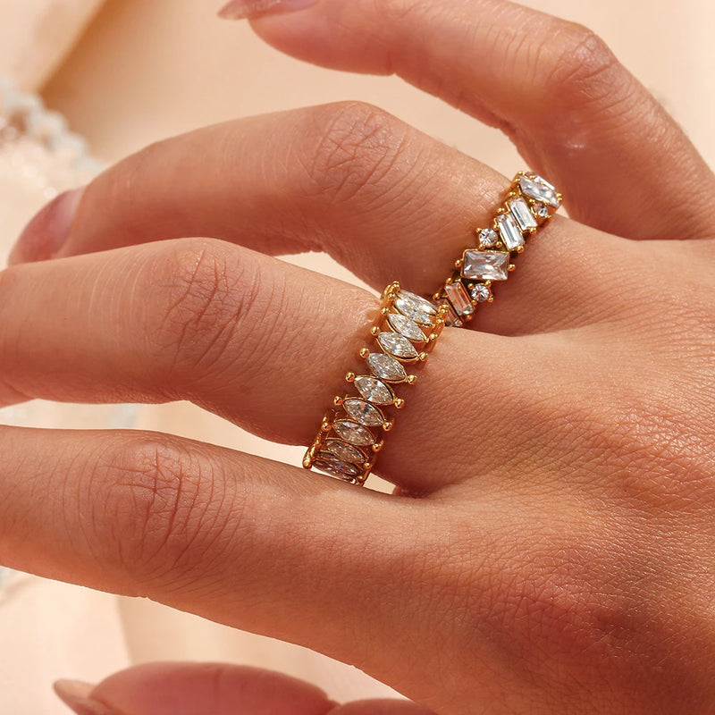 "Close-up of a gold ring with a band formed from cubic zirconia crystals, radiating shimmering elegance and luxury."