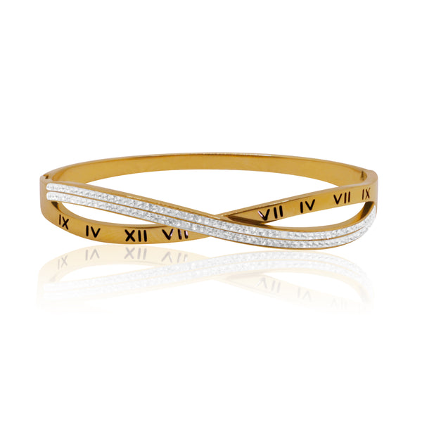 Add a touch of glamour to your wrist with our Roman Numerals Bangle. This stunning bangle showcases sparkling rhinestones and intricate Roman numerals, blending classic and contemporary styles seamlessly. Crafted from durable stainless steel, it's both elegant and resilient, making it a timeless addition to any jewellery collection.