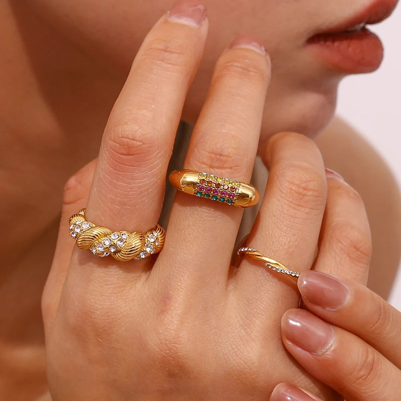 "Close-up of a thin braided band ring with one band encrusted with cubic zirconia stones, offering a blend of elegance and sparkle."