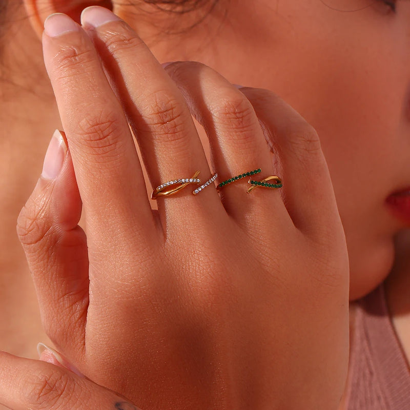 "Close-up of an adjustable ring with a branch crossover design encrusted in cubic zirconia stones, evoking the beauty of nature with intricate detail."