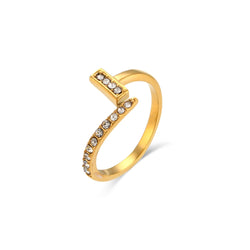 Close-up of an adjustable zirconia crystal ring, featuring sparkling clear crystals set in a gold plated band.