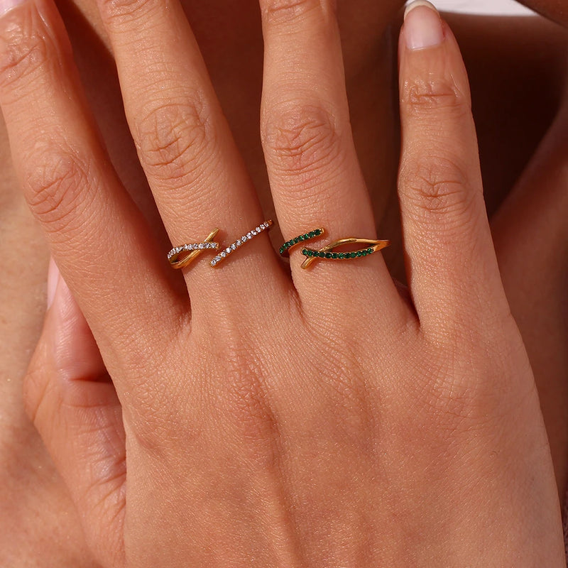 "Close-up of an adjustable ring with a branch crossover design encrusted in cubic zirconia stones, evoking the beauty of nature with intricate detail."