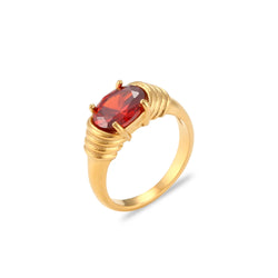 "Close-up of a large oval gemstone ring available in multiple colors, adding a vibrant touch of sophistication to any outfit."