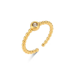 "Close-up of an adjustable ring with a bead-style band and a single sparkling crystal in the center, offering versatile elegance."