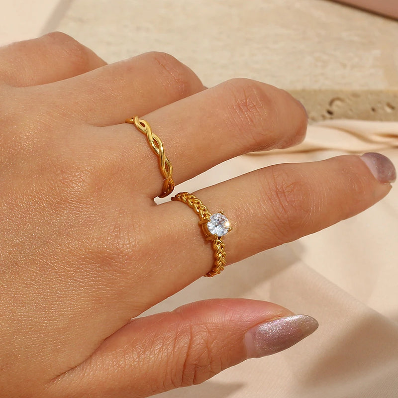 "Close-up of a ring with a thin braided band, showcasing intricate detailing and elegant simplicity."