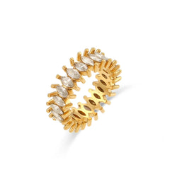 "Close-up of a gold ring with a band formed from cubic zirconia crystals, radiating shimmering elegance and luxury."